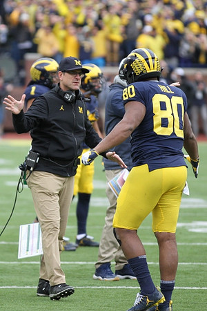 Jim Harbaugh and Khalid Hill (80)