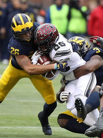 J'Marick Woods (26) and Rashan Gary (3)