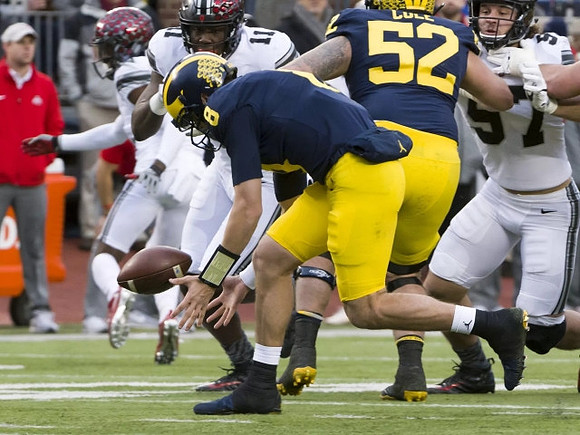 John O'Korn (8) and Mason Cole (52)