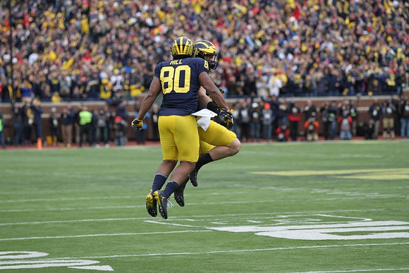 Khalid Hill (80) and Henry Poggi (19)