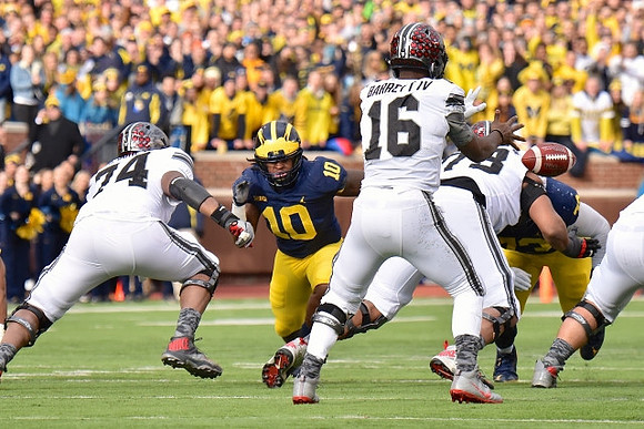 Devin Bush (10) and Maurice Hurst (73)