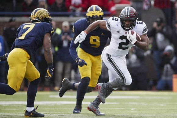 Khaleke Hudson (7) and Mike McCray (9)