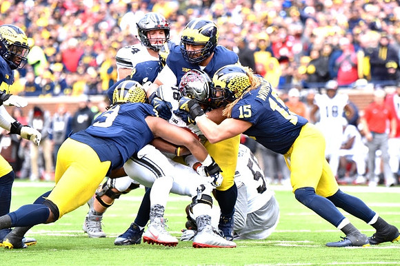 Rashan Gary (3), Bryan Mone (90), and Chase Winovich (15)