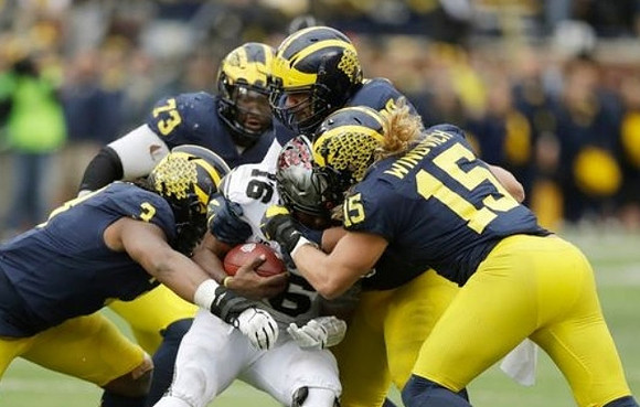 Rashan Gary (3), Maurice Hurst (73), Bryan Mone (90), and Chase Winovich (15)