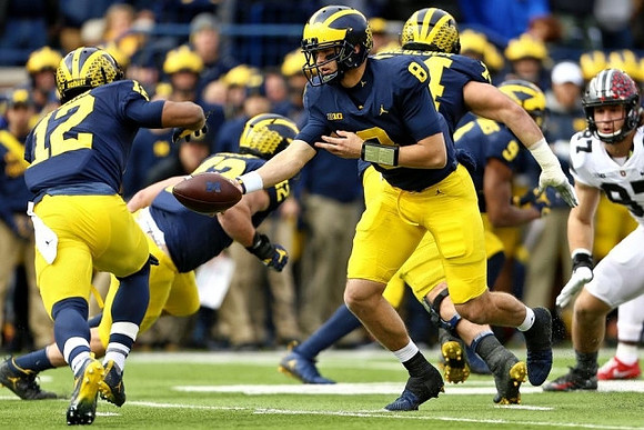 Chris Evans (12), Ben Mason (42), John O'Korn (8), Ben Bredeson (74), and Donovan Peoples-Jones (9)