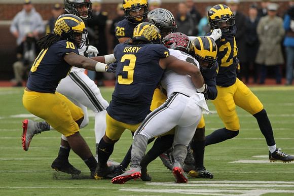 Devin Bush (10), Rashan Gary (3), J'Marick Woods (26), and Lavert Hill (24)