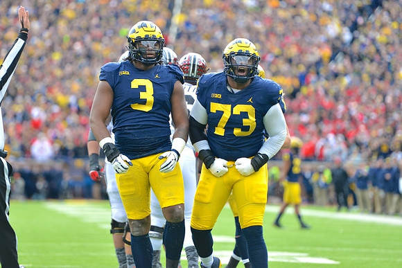 Rashan Gary (3) and Maurice Hurst (73)