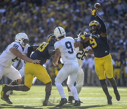 Taco Charlton (33) and Mike McCray (9)