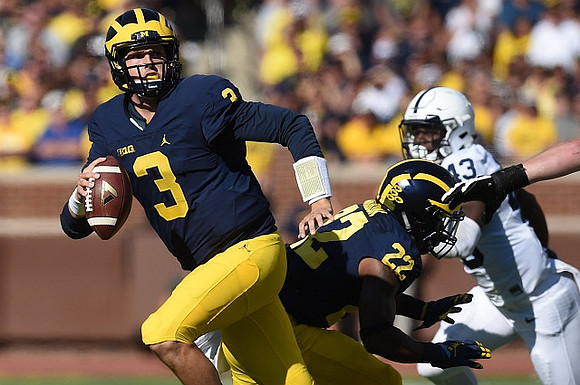 Wilton Speight (3) and Karan Higdon (22)
