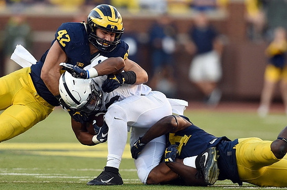 Ben Gedeon (42) and Delano Hill (44)