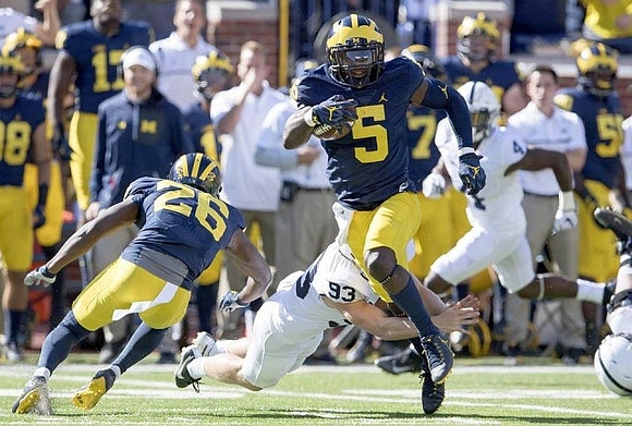 Jourdan Lewis (26) and Jabrill Peppers (5)