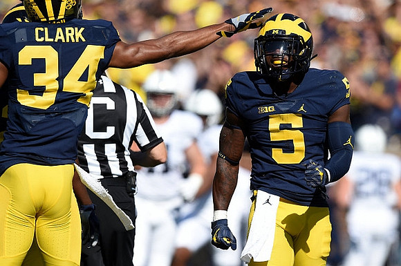 Jeremy Clark (34) and Jabrill Peppers (5)