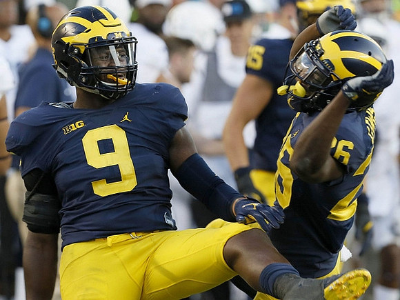 Mike McCray (9) and Jourdan Lewis (26)