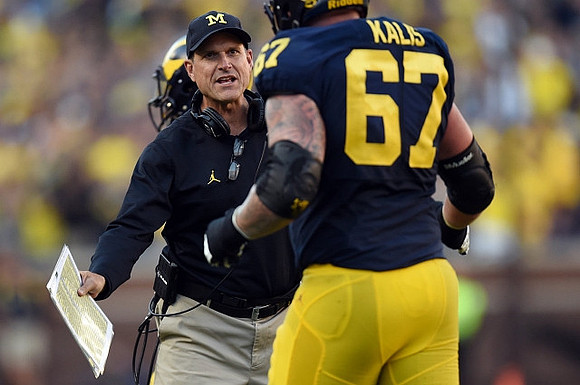 Jim Harbaugh and Kyle Kalis (67)