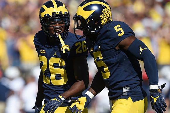 Jourdan Lewis (26) and Jabrill Peppers (5)
