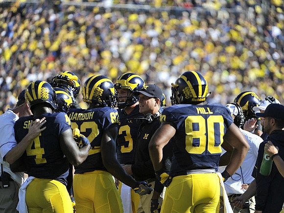 De'Veon Smith (4), Amara Darboh (82), Wilton Speight (3), Jim Harbaugh, and Khalid Hill (80)