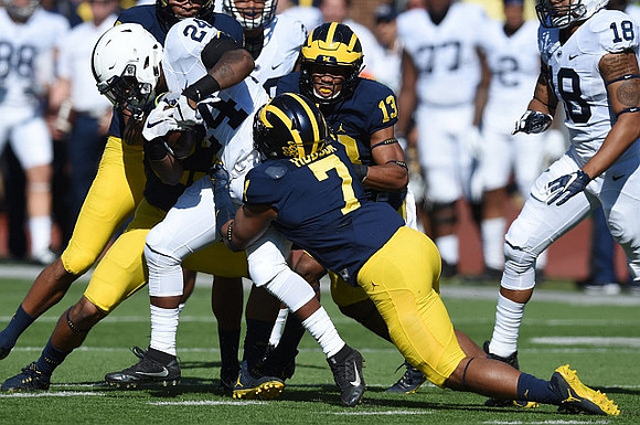 Khaleke Hudson (7) and Josh Metellus (13)
