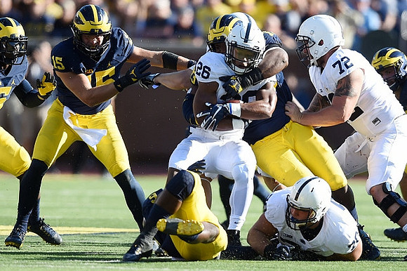 Chase Winovich (15), Mike McCray (9), and Maurice Hurst (73)