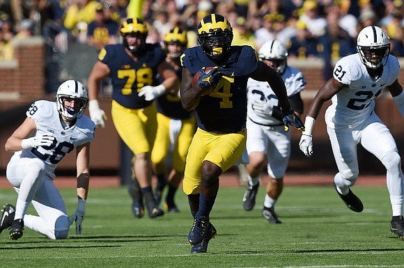 Erik Magnuson (78) and De'Veon Smith (4)