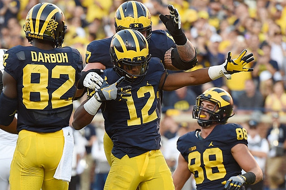 Amara Darboh (82), Kyle Kalis (67), Chris Evans (12), and Jake Butt (88)