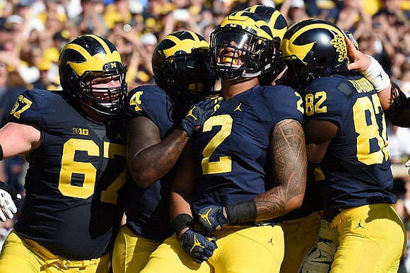 Kyle Kalis (67), De'Veon Smith (4), Devin Asiasi (2), and Amara Darboh (82)