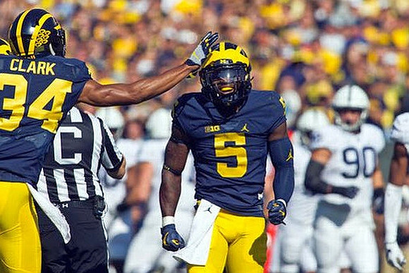 Jeremy Clark (34) and Jabrill Peppers (5)