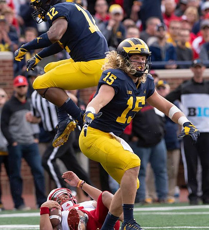 Josh Ross (12) and Chase Winovich (15)