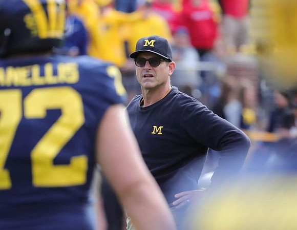 Stephen Spanellis (72) and Jim Harbaugh