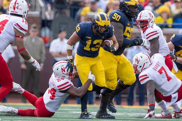 Tru Wilson (13) and Michael Onwenu (50)
