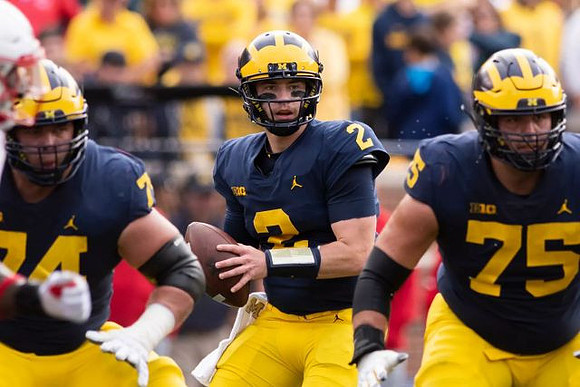 Ben Bredeson (74), Shea Patterson (2), and Jon Runyan Jr. (75)