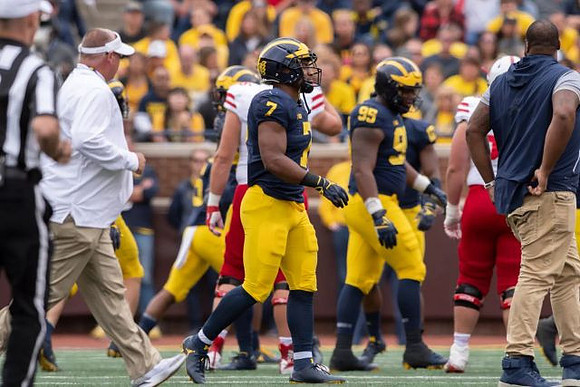 Khaleke Hudson (7) and Donovan Jeter (95)