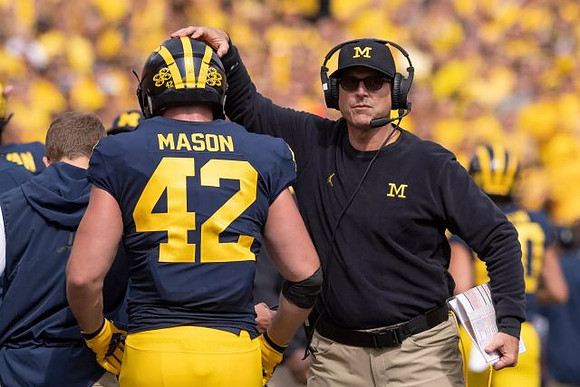 Ben Mason (42) and Jim Harbaugh