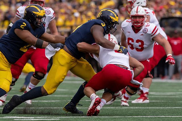 Carlo Kemp (2) and Rashan Gary (3)