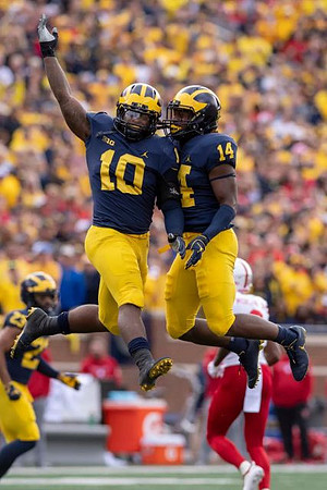 Tyree Kinnel (23), Devin Bush (10), and Josh Metellus (14)