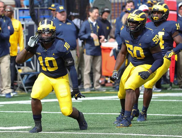 Devin Bush (10), Michael Dwumfour (50), and Josh Metellus (14)