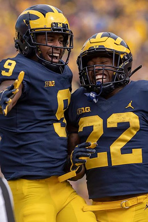 Donovan Peoples-Jones (9) and Karan Higdon (22)