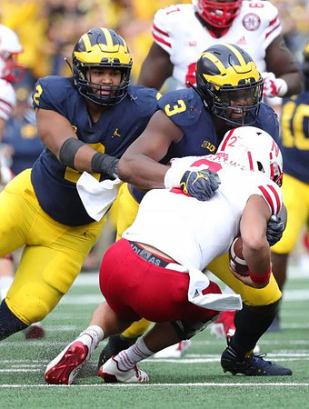 Carlo Kemp (2) and Rashan Gary (3)