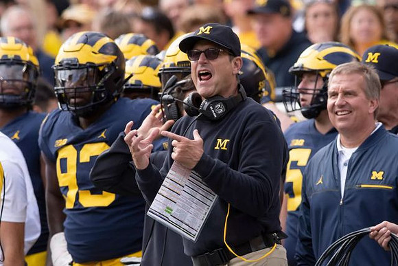 Lawrence Marshall (93), Jim Harbaugh, and Ed Warinner