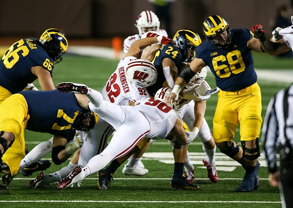 Chuck Filiaga (66), Andrew Stueber (71), Zach Charbonnet (24), and Andrew Vastardis (68)