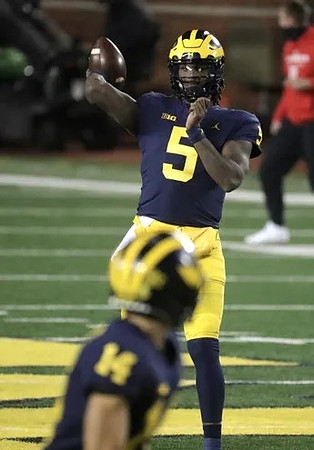 Joe Milton (5) and Roman Wilson (14)