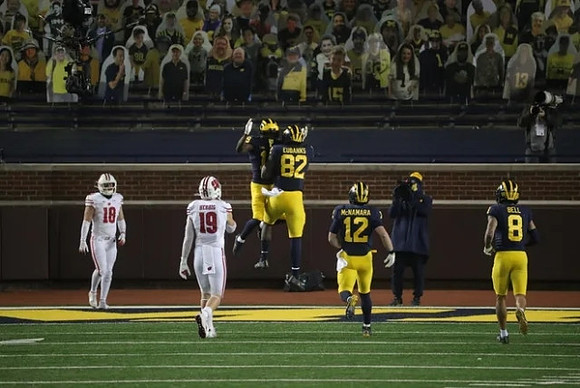 Chris Evans (9), Nick Eubanks (82), Cade McNamara (12), and Ronnie Bell (8)
