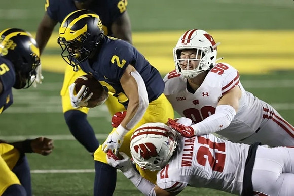 Joe Milton (5), Blake Corum (2), and Nick Eubanks (82)