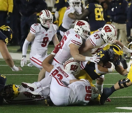 Andrew Vastardis (68), Nick Eubanks (82), and Zach Charbonnet (24)