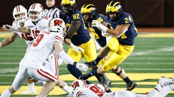 Nick Eubanks (82), Chuck Filiaga (66), and Zach Charbonnet (24)