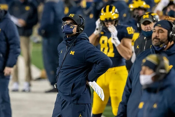 Jim Harbaugh, Nate Schoenle (81), and Shaun Nua