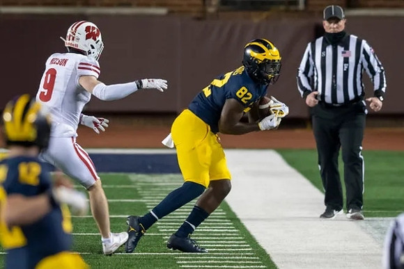 Cade McNamara (12) and Nick Eubanks (82)