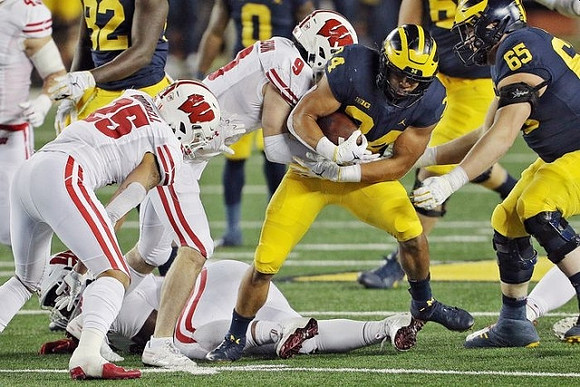 Nick Eubanks (82), Giles Jackson (0), Zach Charbonnet (24), and Zak Zinter (65)
