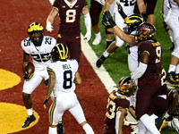 Hassan Haskins (25), Giles Jackson (0), and Ben Mason (42)