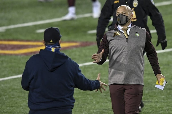 Jim Harbaugh and Minnesota Head Coach P. J. Fleck