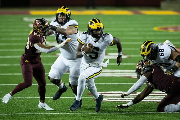 Jalen Mayfield (73), Joe Milton (5), and Andrew Vastardis (68)